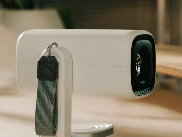 A clean minimal home appliance in a softly lit room.